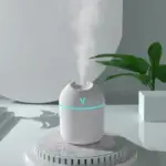 Sleek White Mini Humidifier with Subtle Blue Accent Light